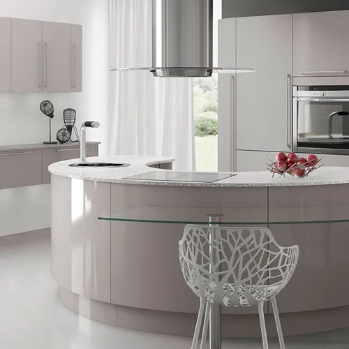 Light modern kitchen with a curved island, glass breakfast ledge and island extractor hood